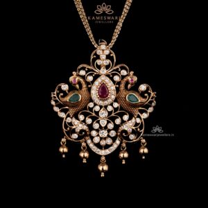 CZ and ruby pendant  with peacock motifs and gold accents.