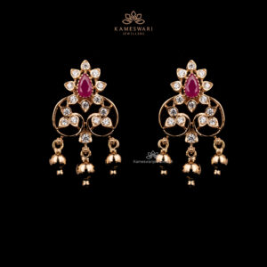 Ruby teardrop CZ earrings with circular motif and gold bell drops.